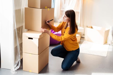 Removalists moving furniture into a new home